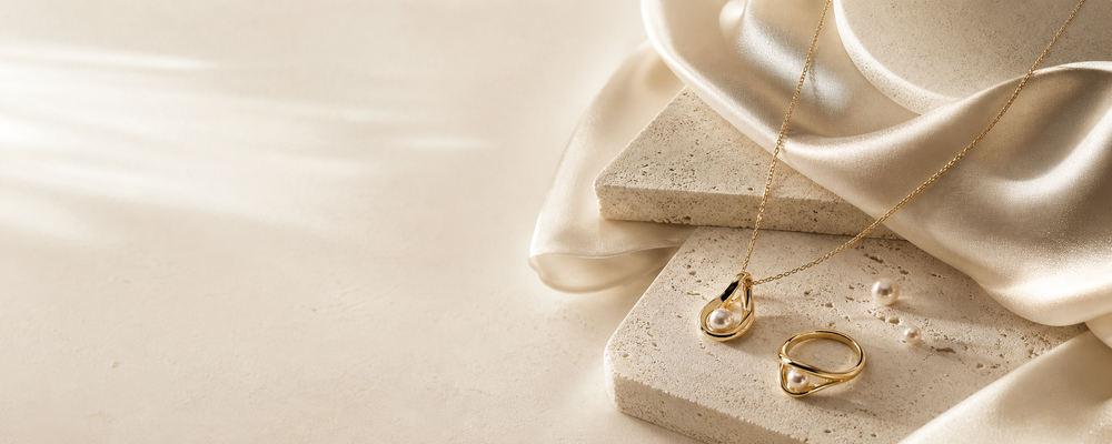 Elodor fine jewelry displayed on a warm neutral surface